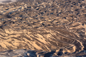 Black Swirls in Beach Sand After High Tide
