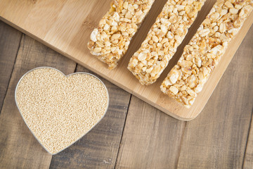 Amaranth bars in the wooden background