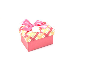 Pink Christmas gift box with pink bow and white tag