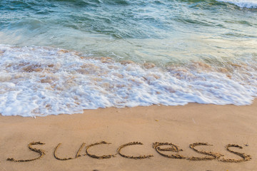 A Handwriting message of success in the sand