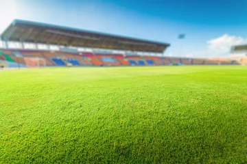 Afwasbaar Fotobehang Voetbal Green grass in soccer stadium