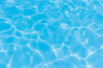 Fototapeta na wymiar Light Blue swimming pool rippled water