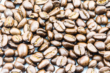 Brown coffee beans isolated on white background