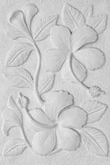 White stone inscription of a China rose, Hawaiian hibiscus, and