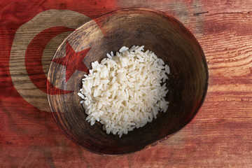 Poverty concept, bowl of rice with Tunisian flag
