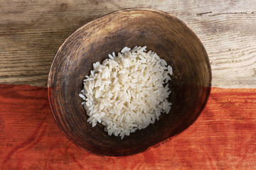 Fototapeta na wymiar Poverty concept, bowl of rice with Polish flag