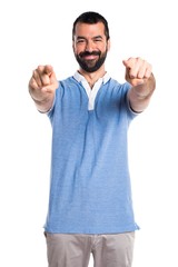 Fototapeta premium Man with blue shirt pointing to the front