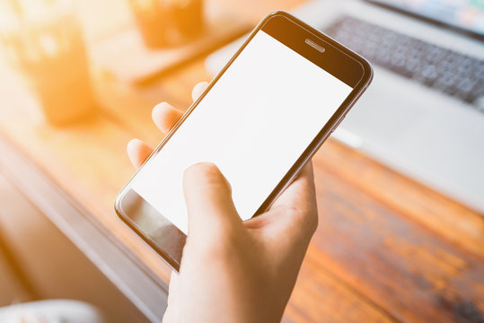 Hand holding smartphone white screen.	