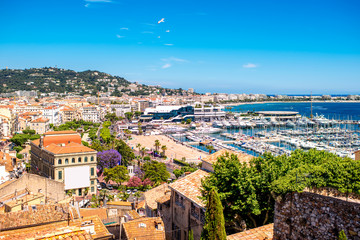 Top cityscape view on french riviera with yachts in Cannes city - obrazy, fototapety, plakaty