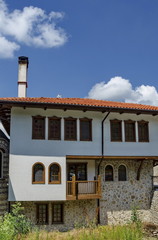 Part of exterior monastic house in restored Montenegrin or Giginski monastery  St. St. Cosmas and Damian, mountain Kitka, Breznik, Pernik region, Bulgaria 