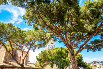 Park near Castre museum with bell tower of the church in Cannes in France