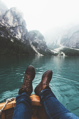 View of feet and lake from a wood boat at Braies
- 121586863