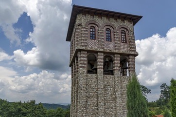 Fototapeta na wymiar View of inner part yard with bell tower in restored Montenegrin or Giginski monastery St. St. Cosmas and Damian, mountain Kitka, Breznik, Pernik region, Bulgaria