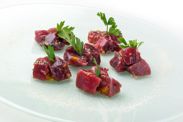 Chunks of rawbluefin tuna in ravigote sauce and parsley