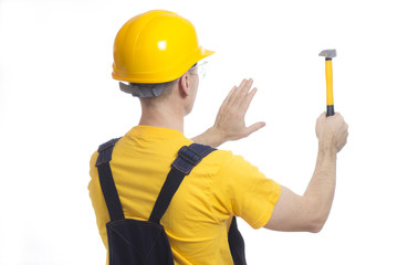 Worker in a helmet and a yellow T-shirt