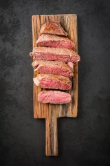 Wall murals Steakhouse Sous vide cooked and seared fillet steak on rustic wooden board