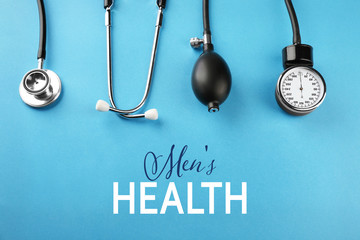 Medical manometer and a stethoscope on blue background. Urology concept