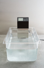 Fototapeta na wymiar Sous vide precision immersion circulator precision cooker with water