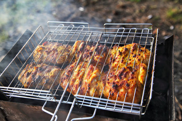 chicken breast grilled on a coals