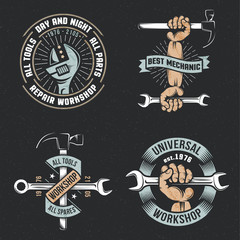 Fototapeta premium Logo, emblem repair workshop with hands and tools in a vintage, retro style on a black background. Textures and background on separate layers.