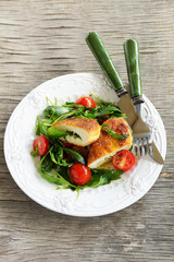 Chicken cutlet with a salad with arugula