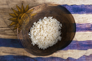 Poverty concept, bowl of rice with Uruguayan flag