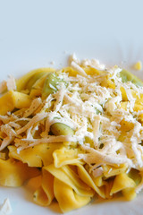 Ravioli filled with spinach and ricotta, Italian egg pasta, with fresh goat cheese on top
