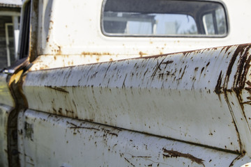 Abandoned and rusted old  truck on farm. Old truck background. Rusty old pickup truck.
