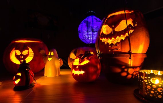 Group of halloween pumpkins on the dark background, dark scenery