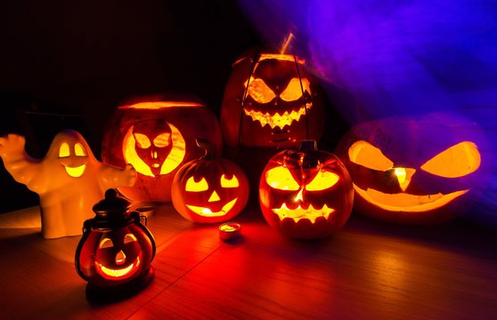 Group halloween pumpkins and the violet smoke