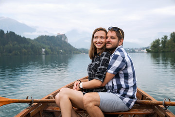 Tourist traveling by traditional wooden boat on the Lake Bled, Slovenia