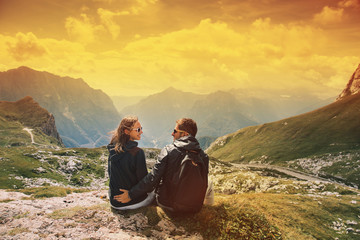 Fototapeta premium Couple of travelers on top of a mountain. Mangart, Julian Alps, National Park, Slovenia