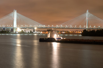 Fototapeta na wymiar Cable-stayed bridge with illumination across the Neva River in St.Petersburg, Russia.