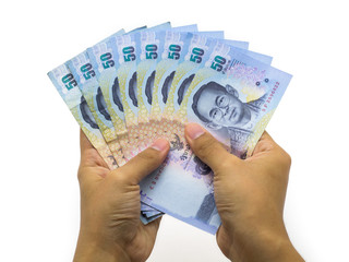 Counting money with Thai baht notes.