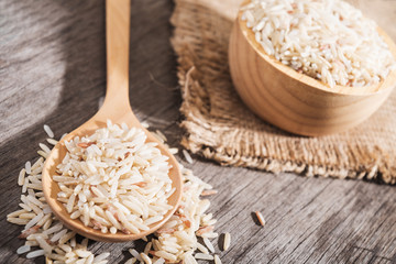 Rice berry or rice berries in wooden spoon