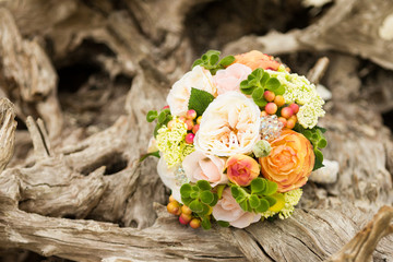 wedding bouquet on beach driftwood
