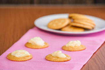 crackers biscuits on wooden background