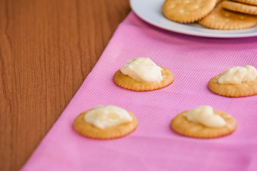 crackers biscuits on wooden background