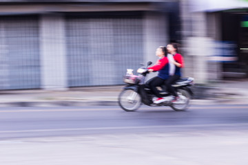 Fototapeta na wymiar Motorcycling Panning In Thailand, women
