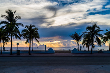 palm trees at tropical beach/Beautiful sunrise over the Atlantic ocean.