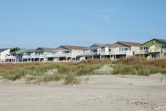 Luxury beach houses along the sand dunes; Sunset Beach, North Carolina