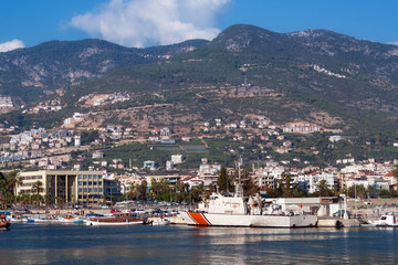 Coast of the Alanya with moored ships and boats. Alanya is a popular resort on the Mediterranean Sea.