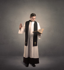 young priest in giving his blessing