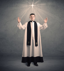 young priest in giving his blessing