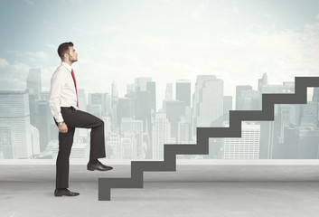 Business person in front of a staircase