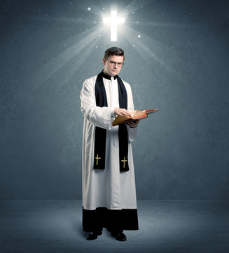 young priest in giving his blessing