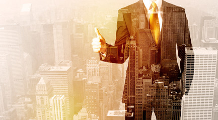 Business man looking at overlay city background