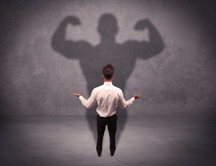 Successful businessman with strong shadow