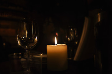 Romantic evening with wineglass and candle