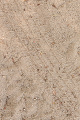 tracks in the sand. Textured background.